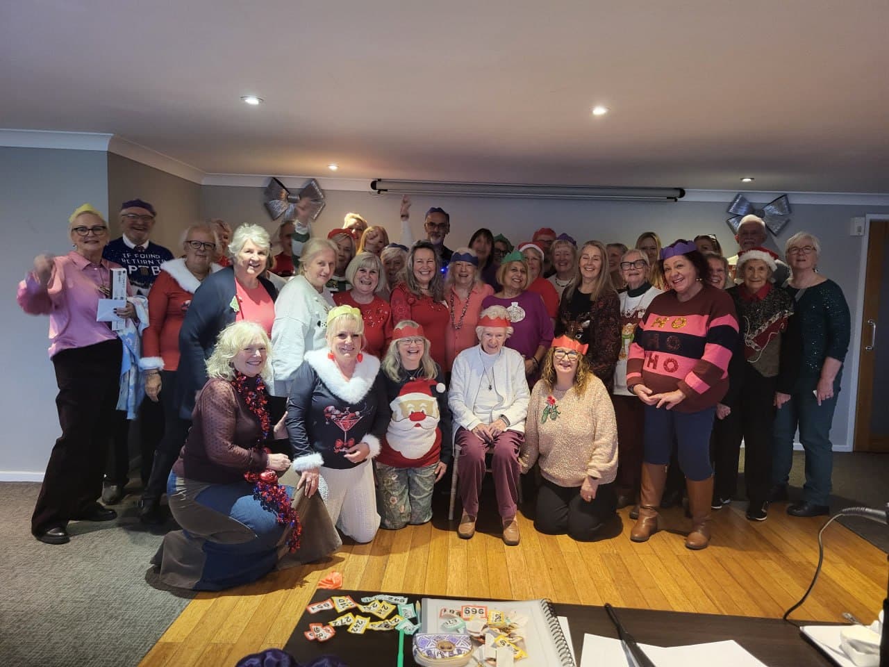 A large group of Lightworkers Lunch guests together at a festive gathering