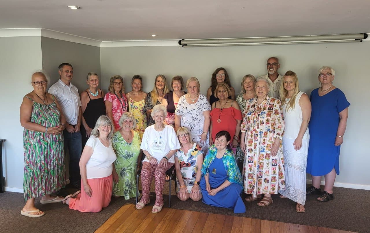 A large group of Lightworkers Lunch guests smiling together